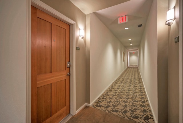 hall featuring carpet