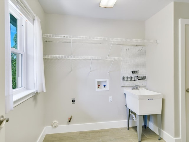 washroom featuring gas dryer hookup, washer hookup, and hookup for an electric dryer