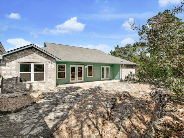 rear view of property with french doors