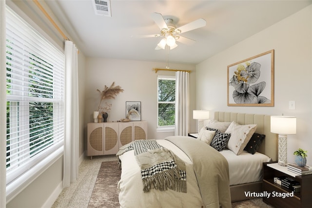 carpeted bedroom featuring ceiling fan