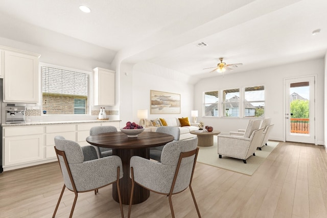 dining space featuring light wood-type flooring and ceiling fan