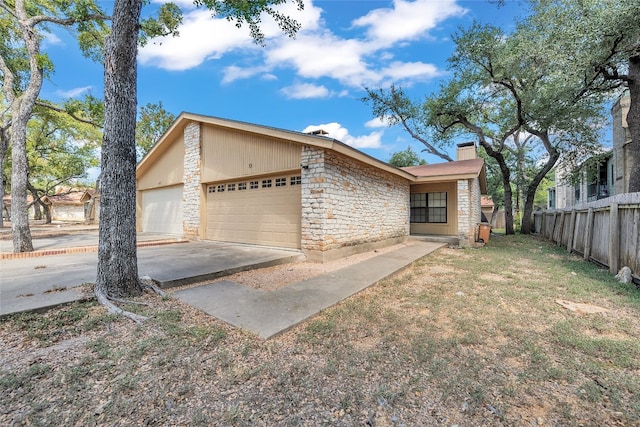 view of front of property with a front lawn and a garage