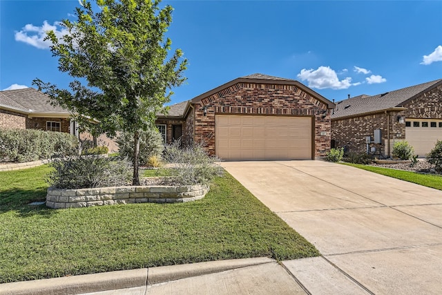 view of front of home with a garage and a front lawn