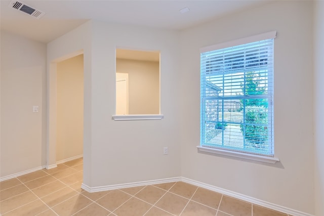 empty room with light tile patterned floors