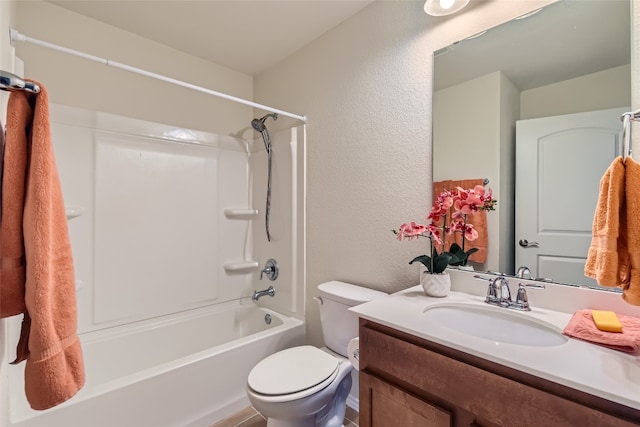 full bathroom with shower / tub combination, vanity, and toilet