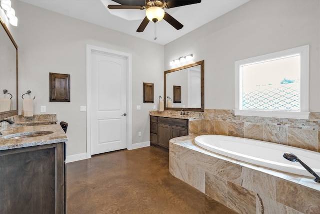 bathroom with a relaxing tiled tub, concrete floors, ceiling fan, and vanity