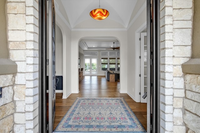 foyer entrance with crown molding, lofted ceiling, dark hardwood / wood-style floors, and ceiling fan