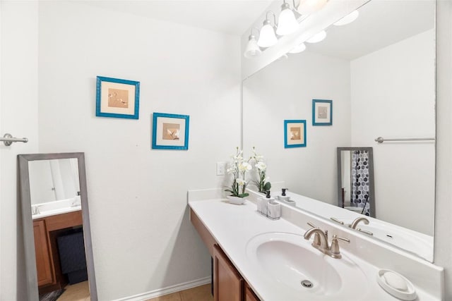 bathroom featuring vanity and baseboards