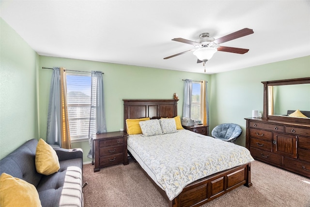 bedroom with light carpet and ceiling fan