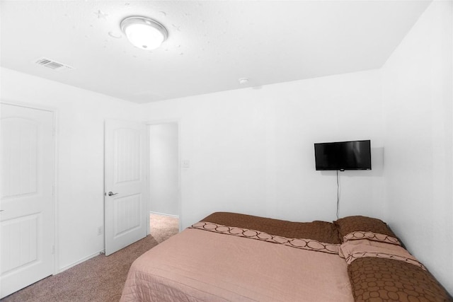 bedroom with light carpet and visible vents