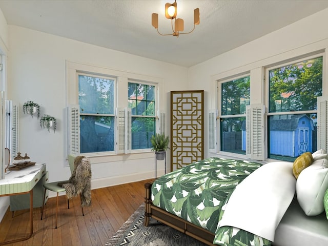 bedroom with wood-type flooring