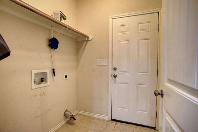 clothes washing area featuring hookup for a washing machine, light tile patterned floors, and electric dryer hookup