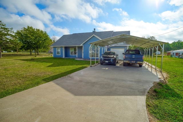 view of front of property with a front yard, a garage, and a carport