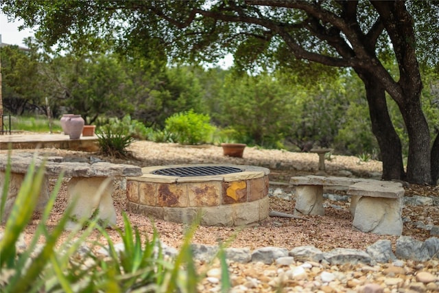 exterior space featuring an outdoor fire pit