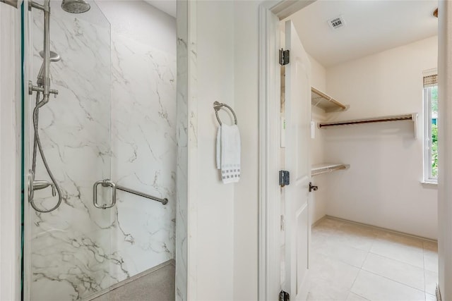 20909 Magellan Cv, Lago Vista, TX 78645 - bathroom with a marble finish shower and tile patterned floors