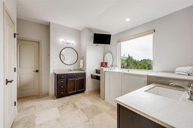 20909 Magellan Cv, Lago Vista, TX 78645 - full bath featuring two vanities and recessed lighting