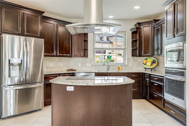 kitchen with dark brown cabinets, stainless steel appliances, island range hood, and a center island