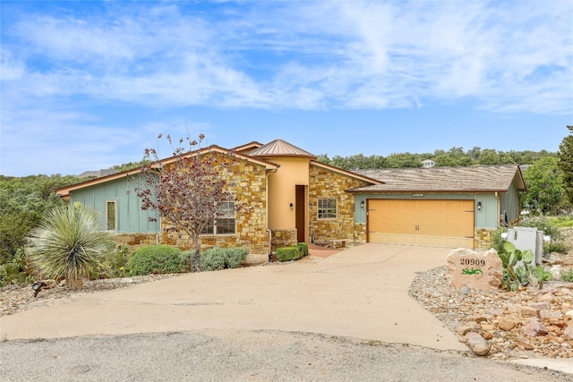 single story home featuring a garage