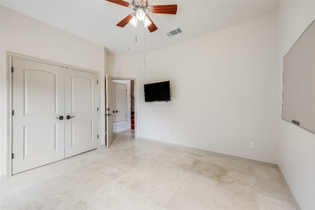20909 Magellan Cv, Lago Vista, TX 78645 - unfurnished bedroom featuring a closet, ceiling fan, and baseboards
