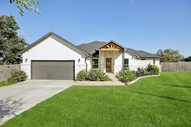 view of front of house with a front lawn and a garage