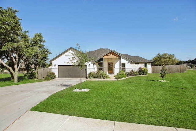 view of front facade with a front lawn and a garage