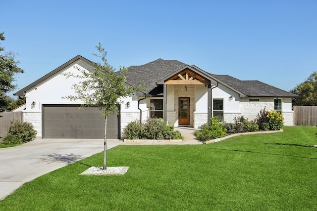 view of front facade featuring a garage and a front yard