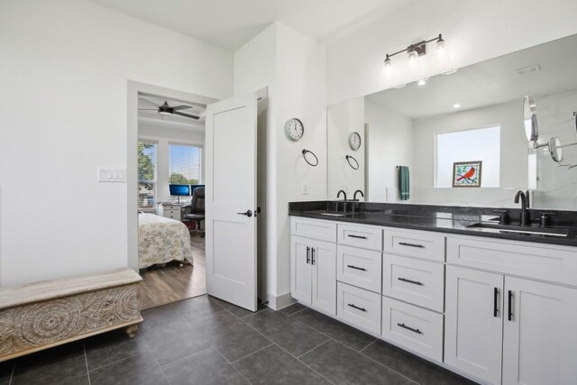 bathroom featuring tile patterned floors, ceiling fan, and vanity