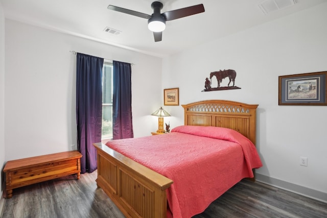 bedroom featuring ceiling fan and dark hardwood / wood-style flooring