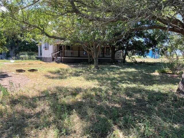 view of yard featuring a wooden deck