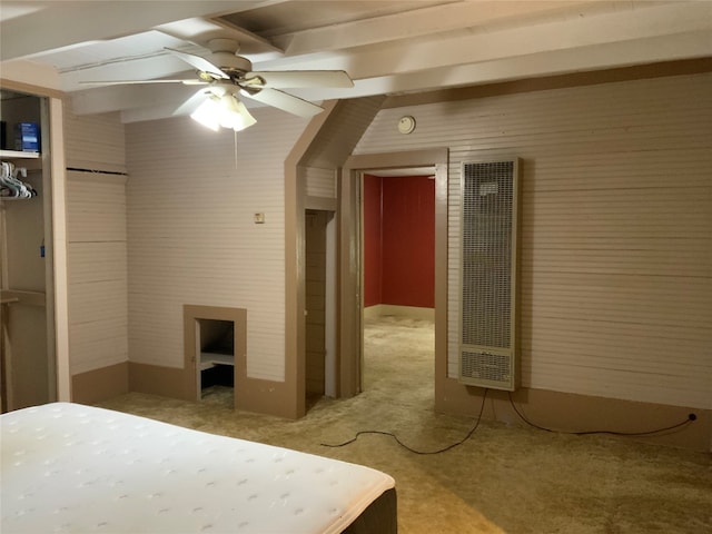 unfurnished bedroom with vaulted ceiling, ceiling fan, and carpet floors