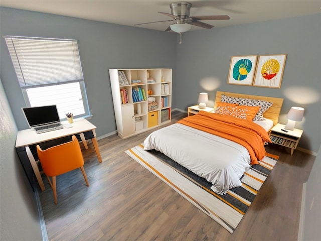 bedroom with wood-type flooring and ceiling fan