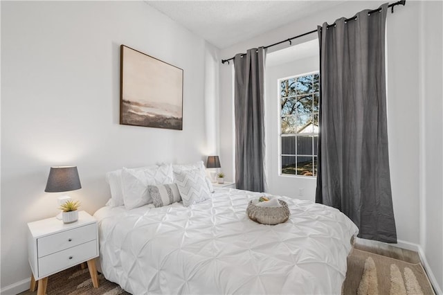 bedroom featuring wood-type flooring