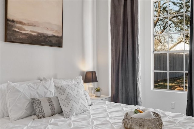 bedroom featuring multiple windows