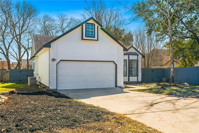 view of front of house with cooling unit and a garage