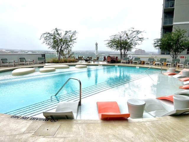 view of pool with a patio area