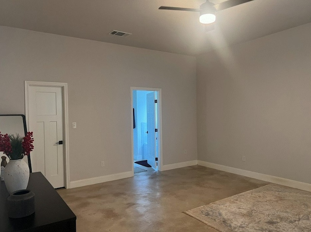 interior space featuring concrete flooring and ceiling fan