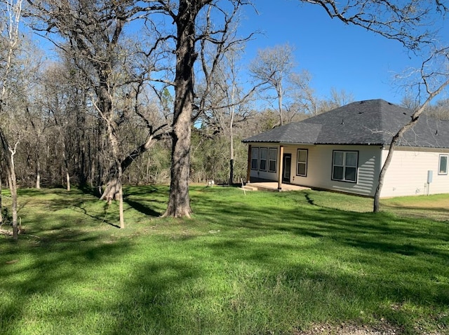 view of yard featuring a sunroom