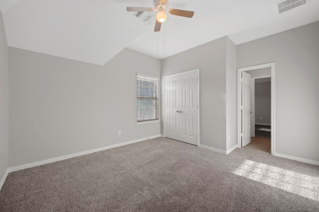 unfurnished bedroom featuring ceiling fan, carpet floors, and a closet