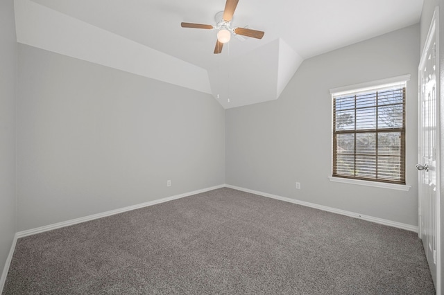 carpeted empty room featuring ceiling fan and lofted ceiling