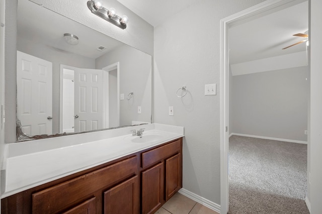 bathroom featuring ceiling fan and vanity