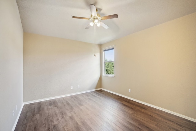 empty room featuring wood-type flooring and ceiling fan