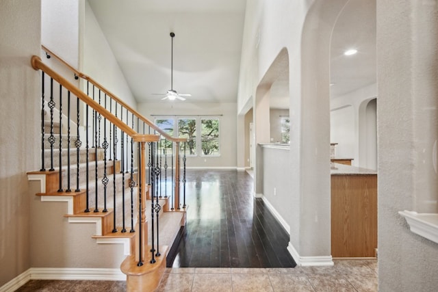 hall featuring lofted ceiling and wood-type flooring