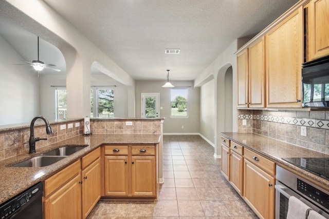 kitchen with light tile patterned floors, sink, a textured ceiling, black appliances, and decorative backsplash