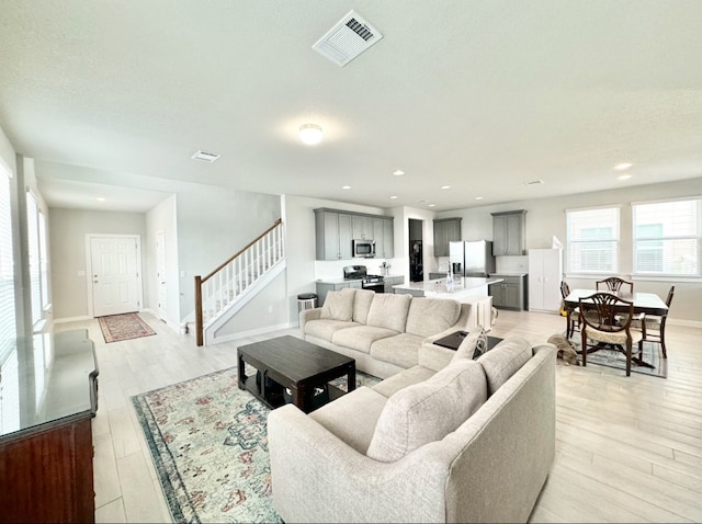 living room with light hardwood / wood-style floors