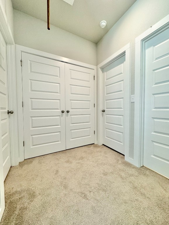 interior space featuring light colored carpet