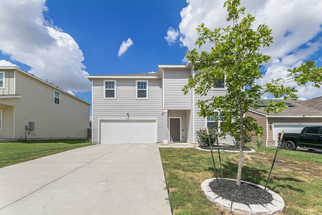 view of front of property with a front yard and a garage