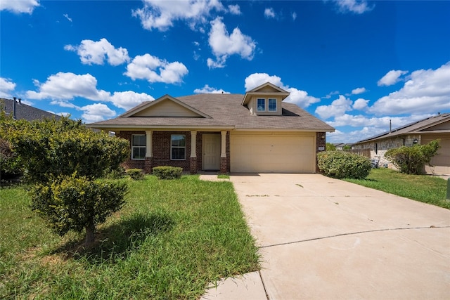 view of front facade with a garage and a front lawn