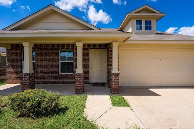 view of front of house featuring a garage and covered porch