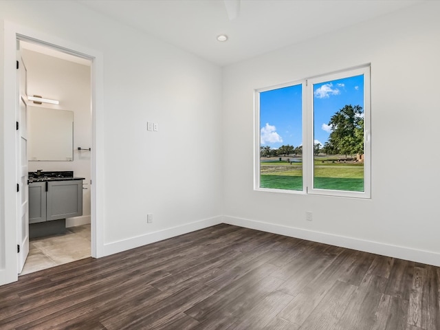 empty room featuring dark hardwood / wood-style flooring