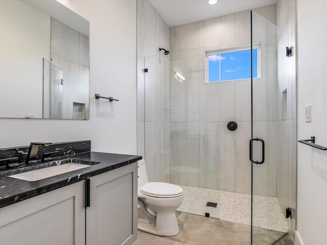 bathroom with walk in shower, tile patterned floors, vanity, and toilet